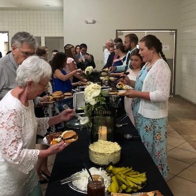 Parents and Grandparents enjoying a catered meal